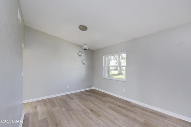 empty room with light hardwood / wood-style floors