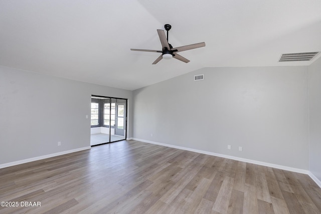 unfurnished room with lofted ceiling, light wood-type flooring, and ceiling fan