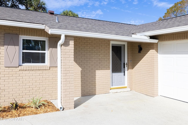 entrance to property featuring a garage