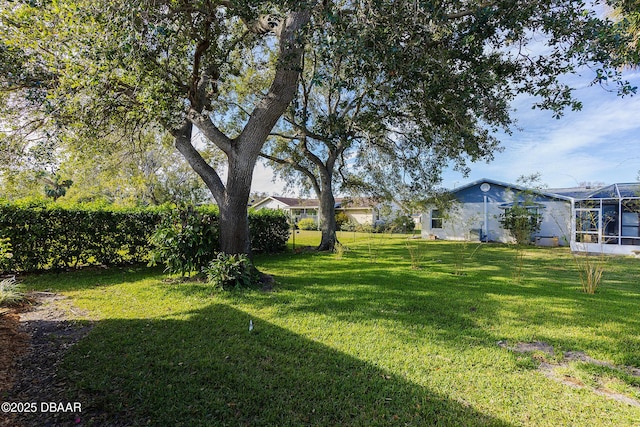 view of yard featuring a lanai