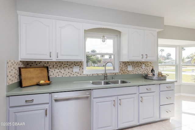 kitchen with white cabinetry, decorative backsplash, dishwasher, and sink