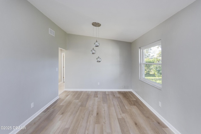 unfurnished dining area with light wood-type flooring