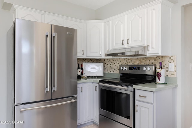 kitchen with stainless steel appliances, backsplash, and white cabinets