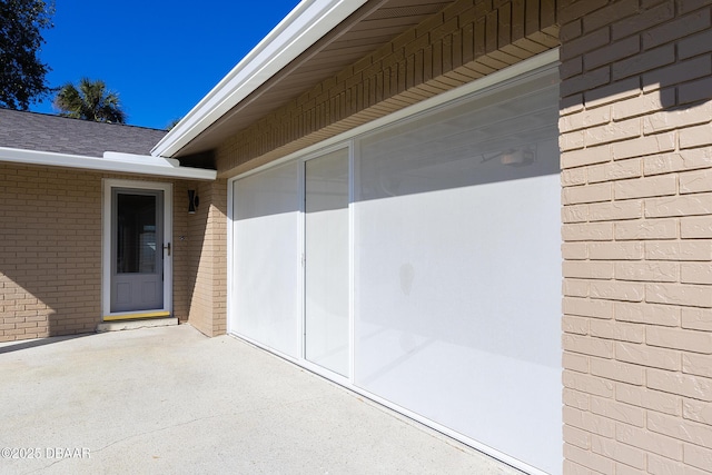 entrance to property with a patio area