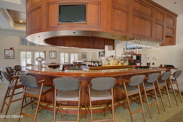 bar featuring a tray ceiling