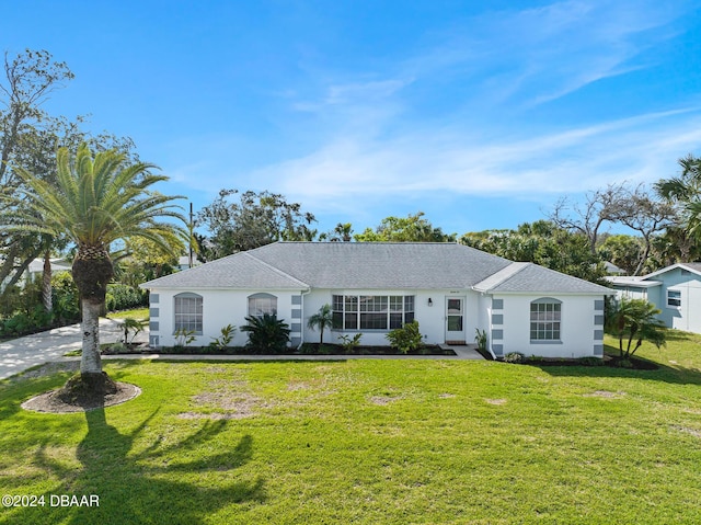 36 Dresden Cir, Ormond Beach, FL 32174 - ranch-style house with a front lawn and stucco siding