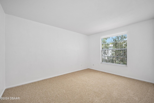 36 Dresden Cir, Ormond Beach, FL 32174 - spare room featuring carpet flooring and baseboards