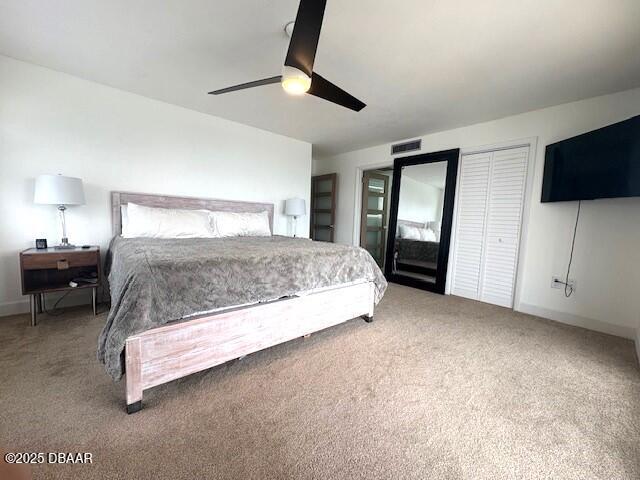 carpeted bedroom featuring a ceiling fan and baseboards