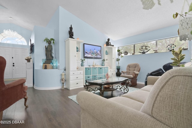 living area with vaulted ceiling, a chandelier, wood finished floors, a textured ceiling, and baseboards