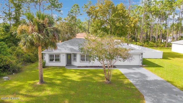 view of front facade featuring a garage and a front lawn