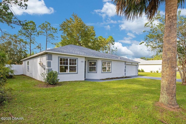 view of front of home with a garage and a front yard