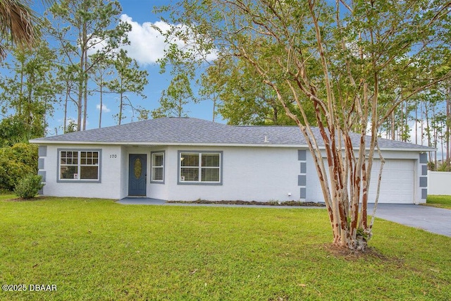 ranch-style house featuring a garage and a front yard