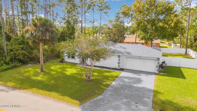 view of front of house featuring a garage and a front yard