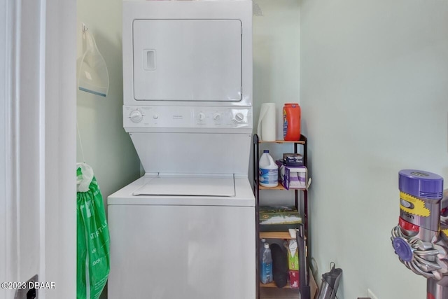 241 Riverside Dr Unit 410, Holly Hill, FL 32117 - washroom with estacked washer and dryer