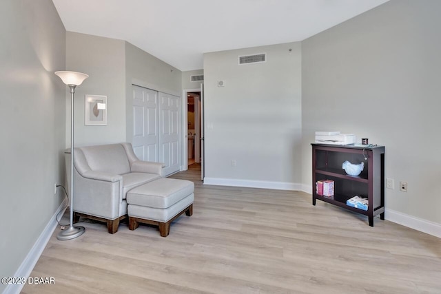241 Riverside Dr Unit 410, Holly Hill, FL 32117 - living area with light wood finished floors and baseboards