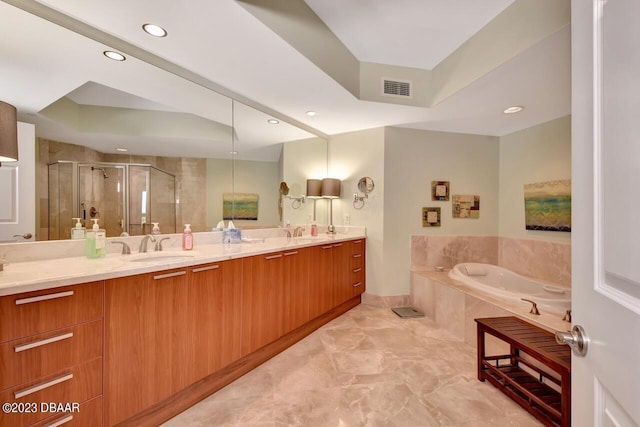 241 Riverside Dr Unit 410, Holly Hill, FL 32117 - full bath featuring a shower stall, a garden tub, double vanity, recessed lighting, and a raised ceiling