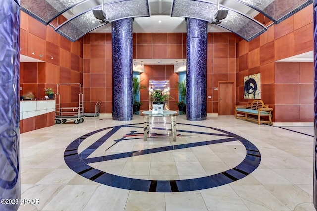 241 Riverside Dr Unit 410, Holly Hill, FL 32117 - lobby featuring a towering ceiling