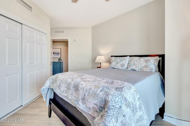 241 Riverside Dr Unit 410, Holly Hill, FL 32117 - bedroom with light wood-style floors and a closet