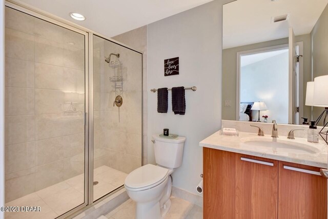 241 Riverside Dr Unit 410, Holly Hill, FL 32117 - bathroom with vanity, a stall shower, toilet, baseboards, and recessed lighting
