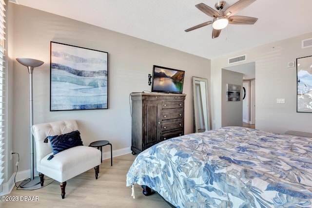 241 Riverside Dr Unit 410, Holly Hill, FL 32117 - bedroom featuring light wood-style floors, baseboards, and a ceiling fan