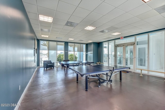241 Riverside Dr Unit 410, Holly Hill, FL 32117 - game room with baseboards, french doors, concrete flooring, and expansive windows