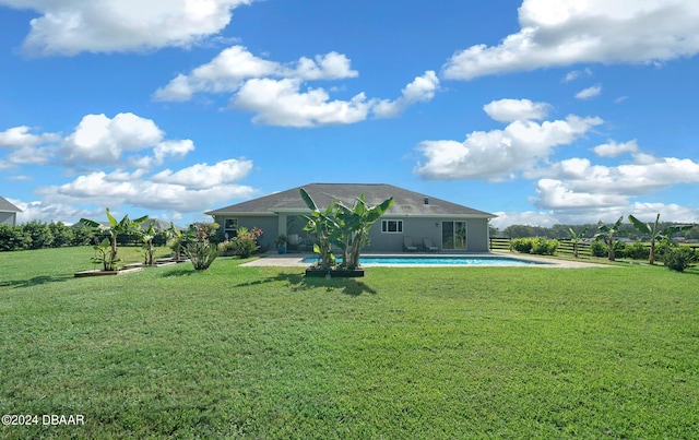 1934 NW 79th Loop, Ocala, FL 34475 - rear view of property featuring a lawn, an outdoor pool, and a patio