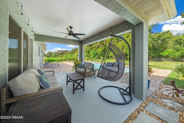 view of patio / terrace with ceiling fan and an outdoor hangout area