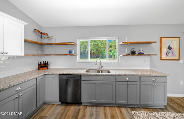 kitchen with dishwasher, gray cabinetry, dark wood-type flooring, and sink