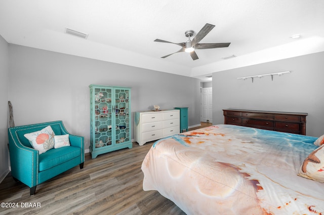 bedroom with hardwood / wood-style flooring and ceiling fan