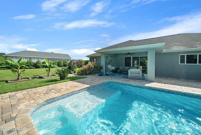 1934 NW 79th Loop, Ocala, FL 34475 - outdoor pool featuring ceiling fan, a patio area, outdoor lounge area, and a lawn