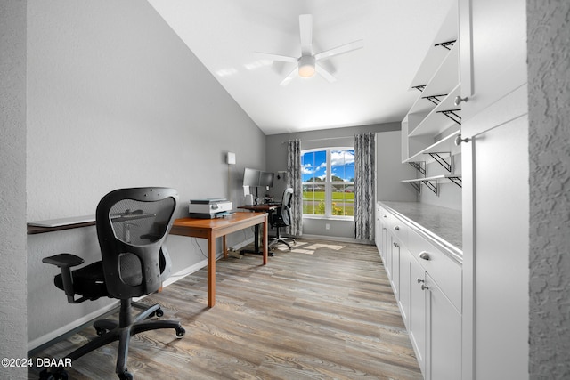 home office with light hardwood / wood-style floors, lofted ceiling, and ceiling fan