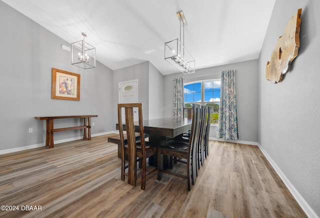 1934 NW 79th Loop, Ocala, FL 34475 - dining room with a chandelier, wood finished floors, and baseboards