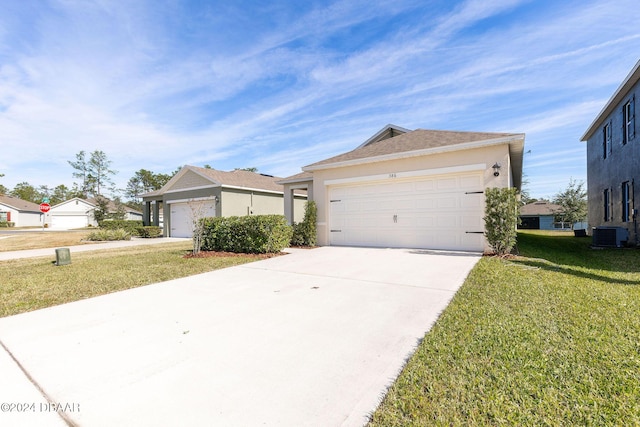 view of front facade featuring a garage, central air condition unit, and a front lawn