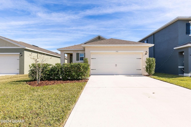 view of front facade with a front lawn and a garage