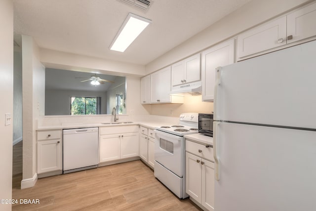 kitchen featuring white appliances, white cabinets, sink, light hardwood / wood-style flooring, and ceiling fan