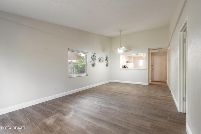 unfurnished dining area featuring a textured ceiling and ceiling fan