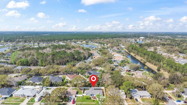 drone / aerial view with a water view and a residential view