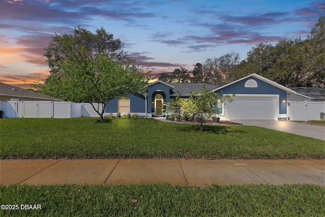 ranch-style home with a front lawn, fence, a garage, driveway, and a gate