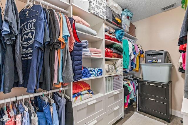 walk in closet with visible vents