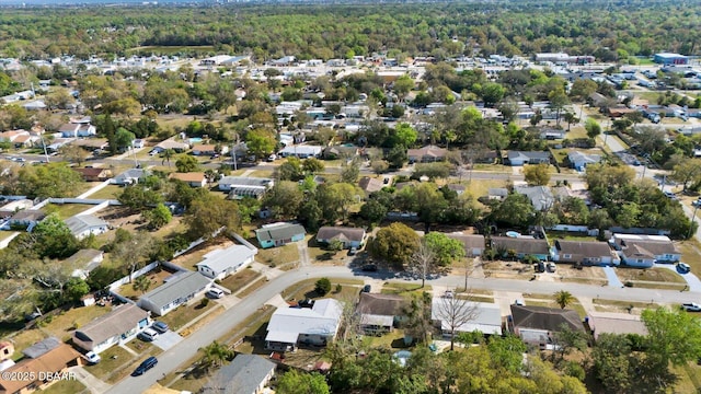 birds eye view of property with a residential view and a forest view