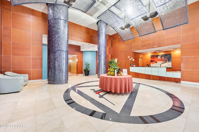 231 Riverside Dr Unit 1106-1, Holly Hill, FL 32117 - community lobby with a high ceiling