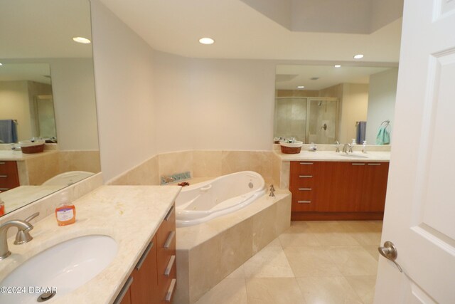 231 Riverside Dr Unit 1106-1, Holly Hill, FL 32117 - bathroom with a shower stall, tile patterned flooring, a tub with jets, two vanities, and recessed lighting