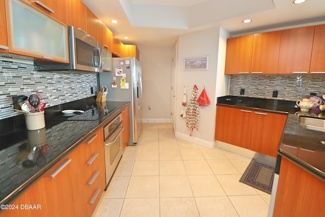 231 Riverside Dr Unit 1106-1, Holly Hill, FL 32117 - kitchen featuring stainless steel appliances, modern cabinets, backsplash, brown cabinets, and recessed lighting