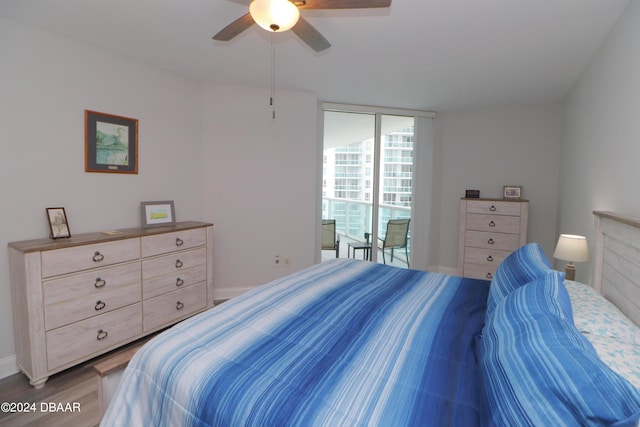 bedroom featuring hardwood / wood-style floors and ceiling fan