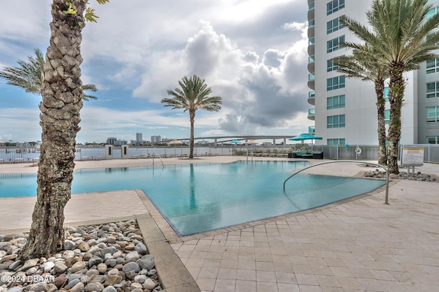 231 Riverside Dr Unit 1106-1, Holly Hill, FL 32117 - community pool with fence, a patio area, a view of city, and cooling unit