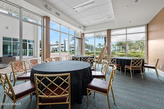 231 Riverside Dr Unit 1106-1, Holly Hill, FL 32117 - sunroom / solarium featuring plenty of natural light, carpet floors, and a drop ceiling
