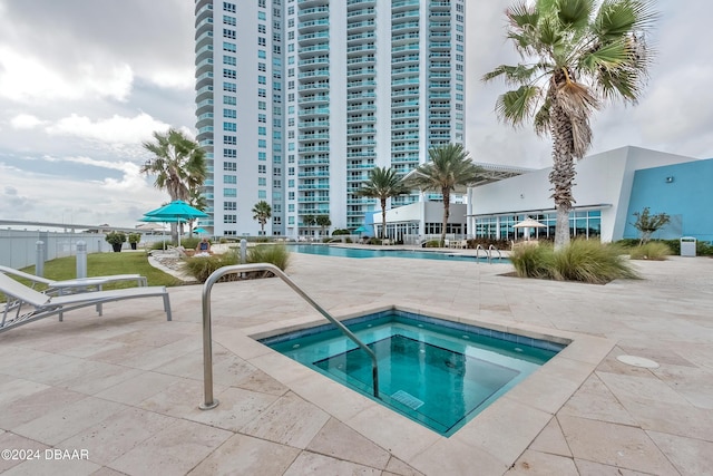 231 Riverside Dr Unit 1106-1, Holly Hill, FL 32117 - community pool featuring a hot tub and a patio area