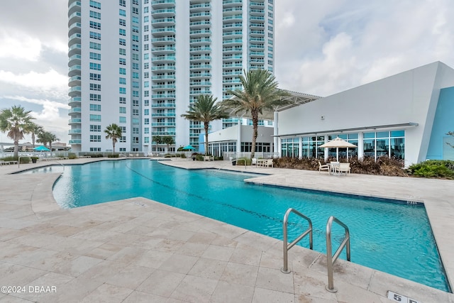 view of swimming pool with a patio area