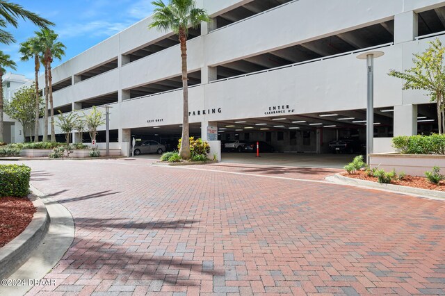 231 Riverside Dr Unit 1106-1, Holly Hill, FL 32117 - view of building exterior with covered parking