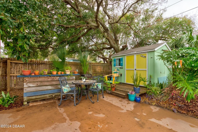 view of patio / terrace featuring a storage unit